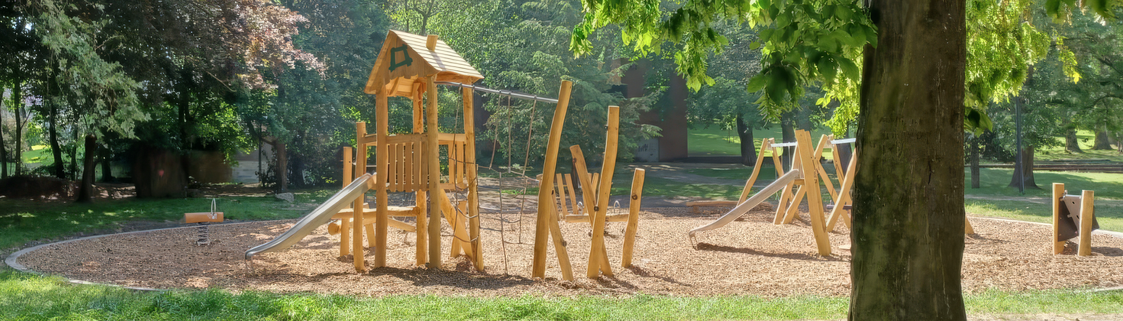 Wooden playground towers in a sunlit park